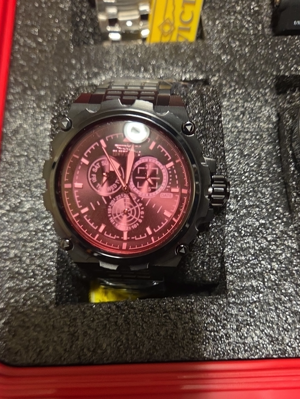 Invicta Black Metal Chronograph Watch with Red Dial